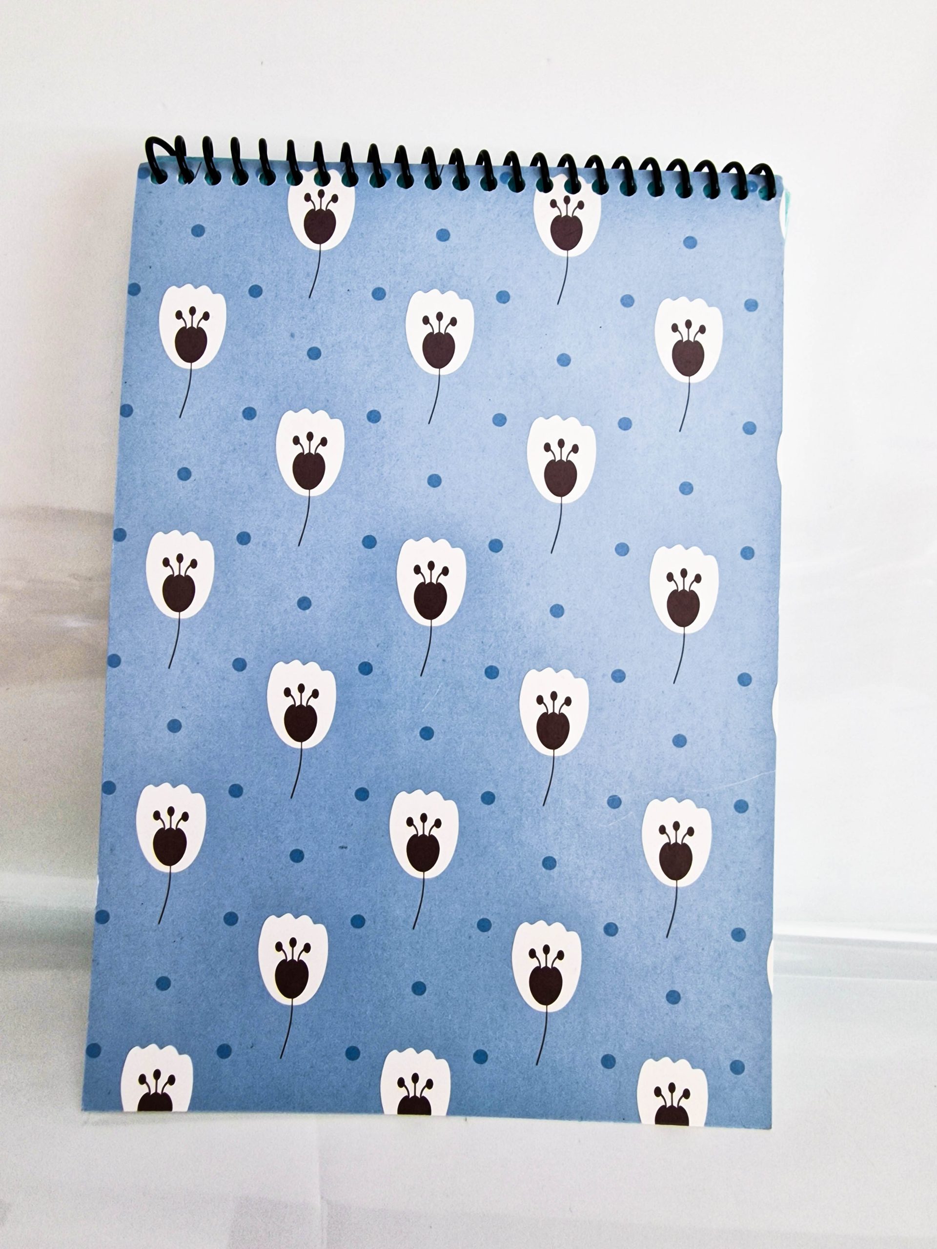 bloco capa azul com flor branca